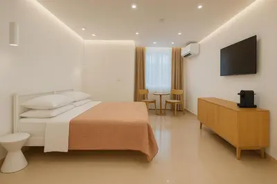 a hotel room with a bed and a television at NERI Vatican Suite in Rome