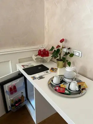 a white counter with a table with a plate on it at Piazza Venezia appartamento con vista in Rome