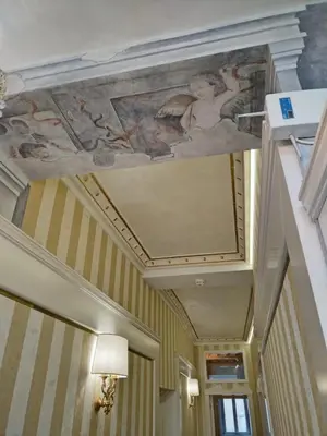 a painting on the ceiling of a hallway at Piazza Venezia appartamento con vista in Rome
