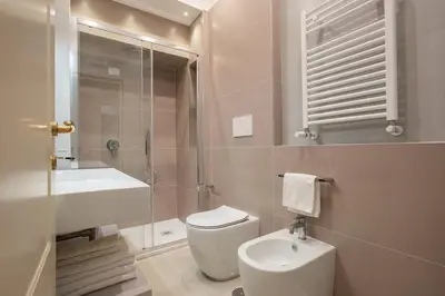 a bathroom with a toilet and a sink and a shower at Casa Mia in Rome
