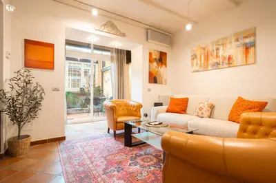 a kitchen and dining room with a table and chairs at Casa Verde - Luxury apartment in Trastevere in Rome