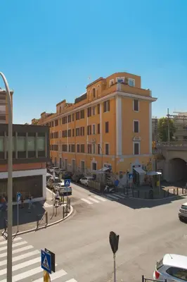 a city street with a building and a parking lot at Duplex Chic in zona trendy in Rome
