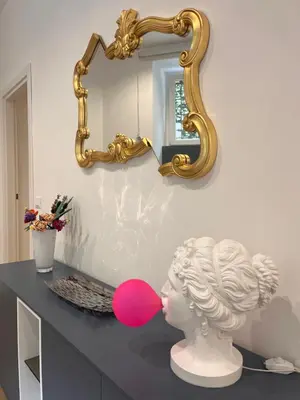 a statue of a bust in front of a mirror at Casa Vacanze Villa Barberina in Rome