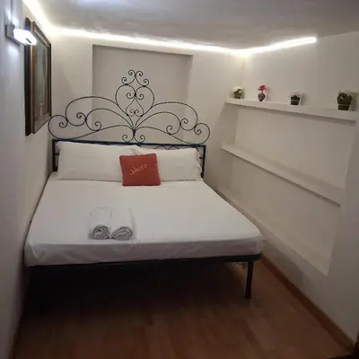 a kitchen with a couch and a table with a microwave at Vatican Apartaments Holiday in Roma in Rome