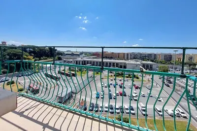 an aerial view of a parking lot with cars at Ostiense station penthouse in Rome
