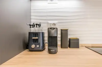 a kitchen counter with a blender and a toaster at Domus urbe San Paolo in Rome