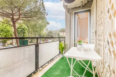 a balcony with a white table and a window at Domus urbe San Paolo in Rome