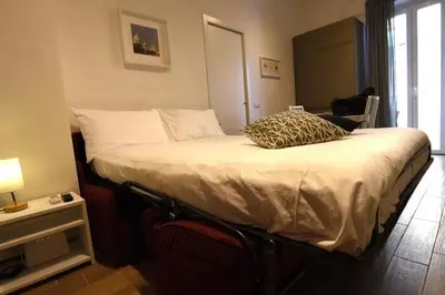 a bedroom with a bed with a pillow on it at LG Apartment - Near Vatican City, Rome in Rome