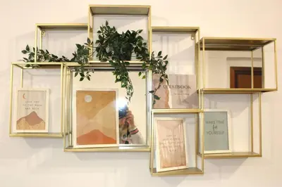 a person taking a picture of a mirror with a plant at ValGa Suite near Vaticano and Centre in Rome