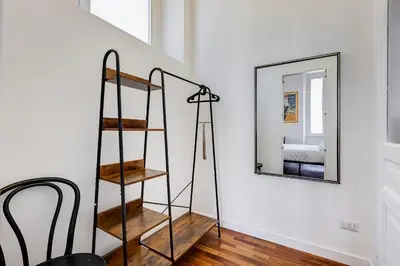 a room with a ladder and a mirror at Elegant 3-Bedroom Apartment in Piazza Mazzini in Rome