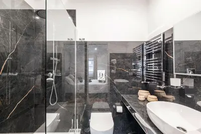 a bathroom with a toilet and a sink and a shower at The Best Rent - Refined multi-room apartment in Termini area in Rome