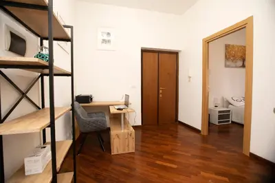 a room with a desk and a bunk bed at Relais Rosselli in Rome