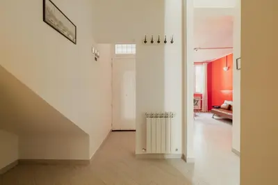 an empty hallway with a staircase in a house at Urban Loft Piramide in Rome