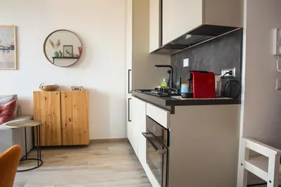 a small kitchen with a counter top in a room at Via Rocca House in Rome