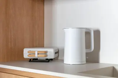 a white juicer sitting on top of a counter at Design Suite apartment Piazza di Spagna in Rome