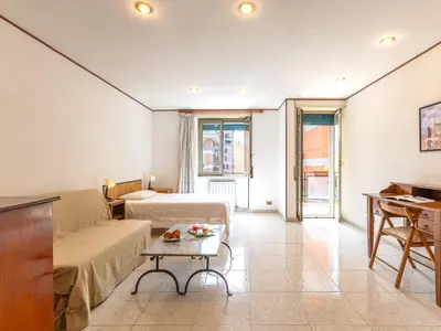 a hotel room with a bed and a table at Casa Lo Vercio in Rome
