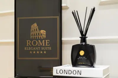 a black vase sitting on a table with a picture of the rome elephant at Rome Elegant Suite in Rome