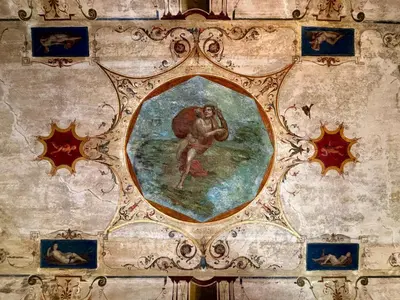 a painting of a man on a wall at Atelier ed Affreschi a Campo de Fiori in Rome