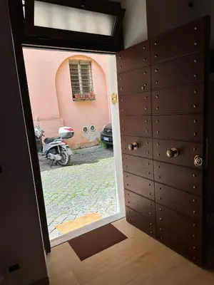 a door leading into a room with a window at Suite at the Coliseum in Rome