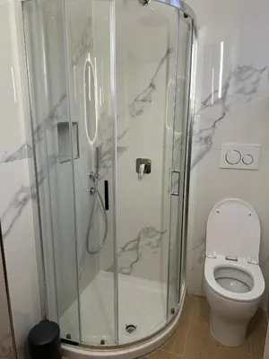a bathroom with a shower and a toilet at Suite at the Coliseum in Rome