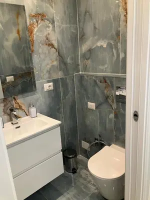 a bathroom with a sink and a toilet at Principe Umberto piano terra in Rome