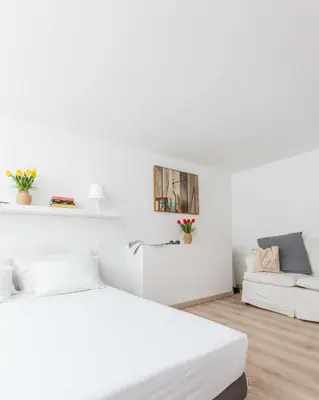 a white room with two beds and a couch at Mini apartment Cairoli 2 - Zeno 42 in Rome