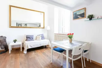 a living room with a table and a couch at Mini apartment Cairoli 2 - Zeno 42 in Rome