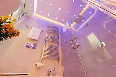 a bathroom with a shower and a sink with a window at 30' Walk Vatican & Stadium Art, Smart Home in Rome