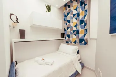 a small room with a bed and a window at 30' Walk Vatican & Stadium Art, Smart Home in Rome