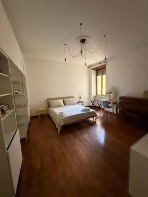 a bedroom with a bed and a piano in it at Casa Letizia - Rome Prati Vatican - Intero appartamento in Rome