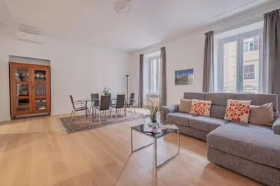 a living room with a couch and a table at Life Home Vatican in Rome
