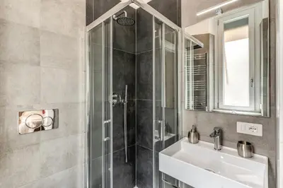 a bathroom with a sink and a shower at Clodio Guest House in Rome