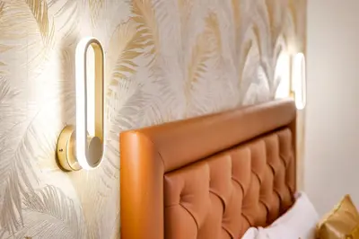 a headboard of a bed in a room with a wall at Dimora Merulana 183 in Rome