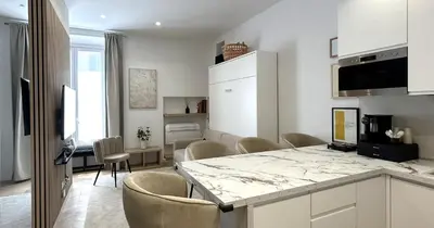 a kitchen and dining room with a table and chairs at YCH-Vatican Superior Suite in Rome