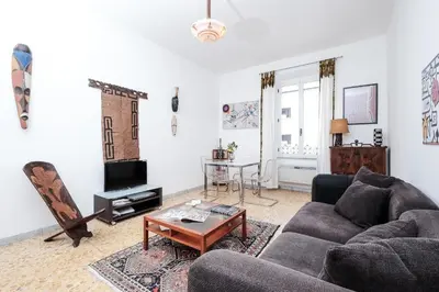 a living room with a couch and a table at Linda Apartment in Rome