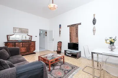 a living room with a couch and a table at Linda Apartment in Rome