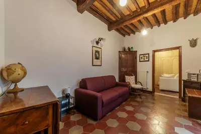 a living room with a couch and a table at GuestHost - Stylish Apartment in the Heart of Rome in Rome