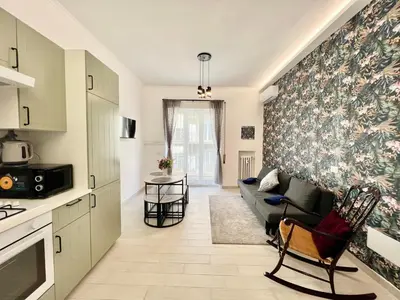 a living room with a couch and a table at Stylish Apartment near Trastevere in Rome