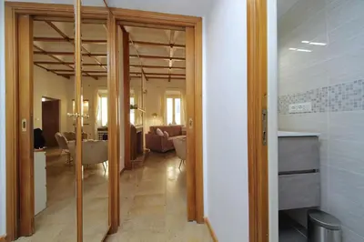 a hallway with a living room and a dining room at MM Trevi Apartment in Rome