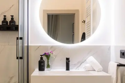 a bathroom with a sink and a mirror at Piazza del Popolo Boutique GuestHouse in Rome