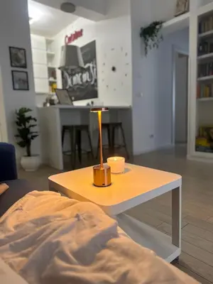 a coffee table with a candle on it in a living room at Silvestri206 in Rome