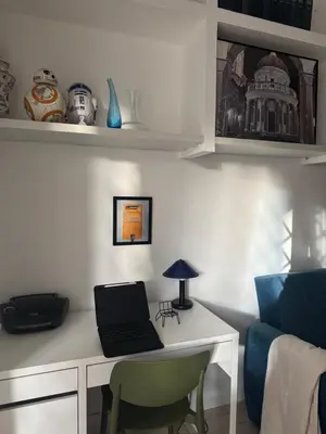 a room with a desk with a laptop on it at Silvestri206 in Rome