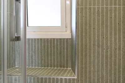 a bathroom with a toilet and a glass shower at Civico7 - Luxury Apartment in Rome