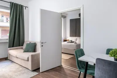 a room with a couch and a table and a bed at Vatican Dimora Apartments in Rome