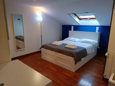 a bedroom with a bed with two towels on it at Attico GianLuce in Rome