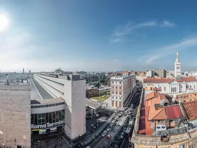 an aerial view of a city with buildings and cars at Raeli Hotel Siracusa in Rome
