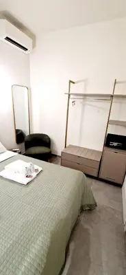 a room with a bed and an empty shower at Roma Suite Style in Rome