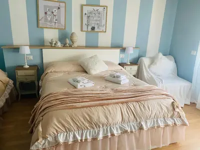 a bedroom with a bed with two towels on it at Mami Guest House Rome Vatican St Peters in Rome