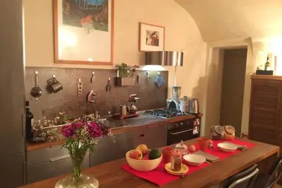 a kitchen with a table with fruit on it at Appartamento Piazza Farnese in Rome