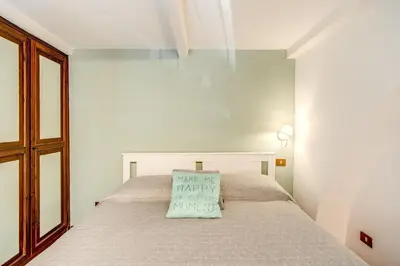 a bedroom with a bed with a pillow on it at Link Campus Apartment in Rome